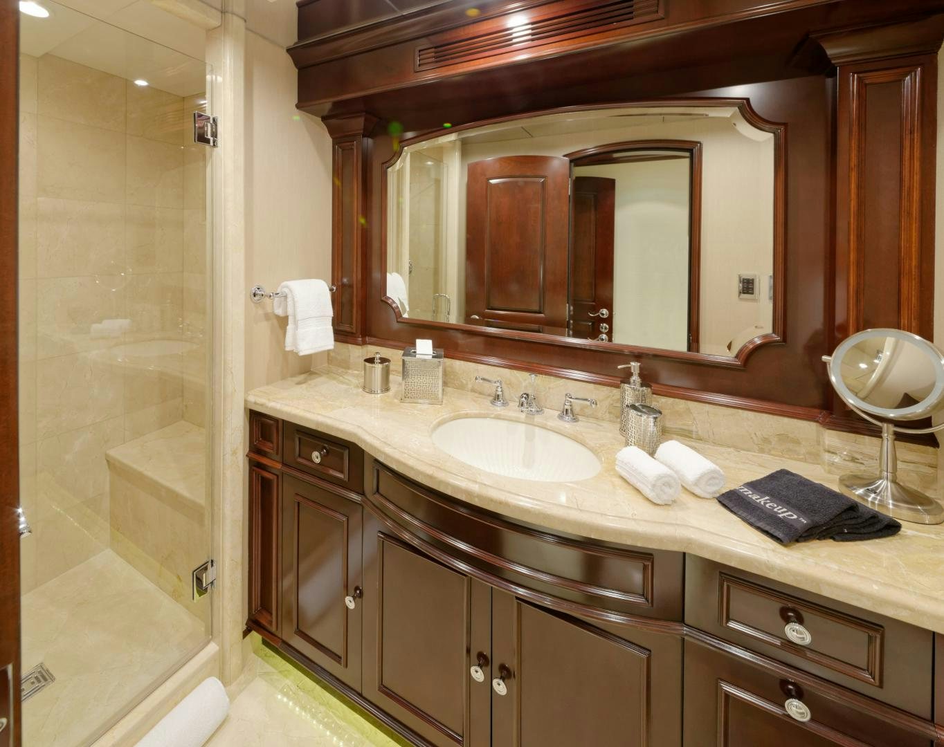 a bathroom with a large mirror aboard REBEL Yacht for Sale