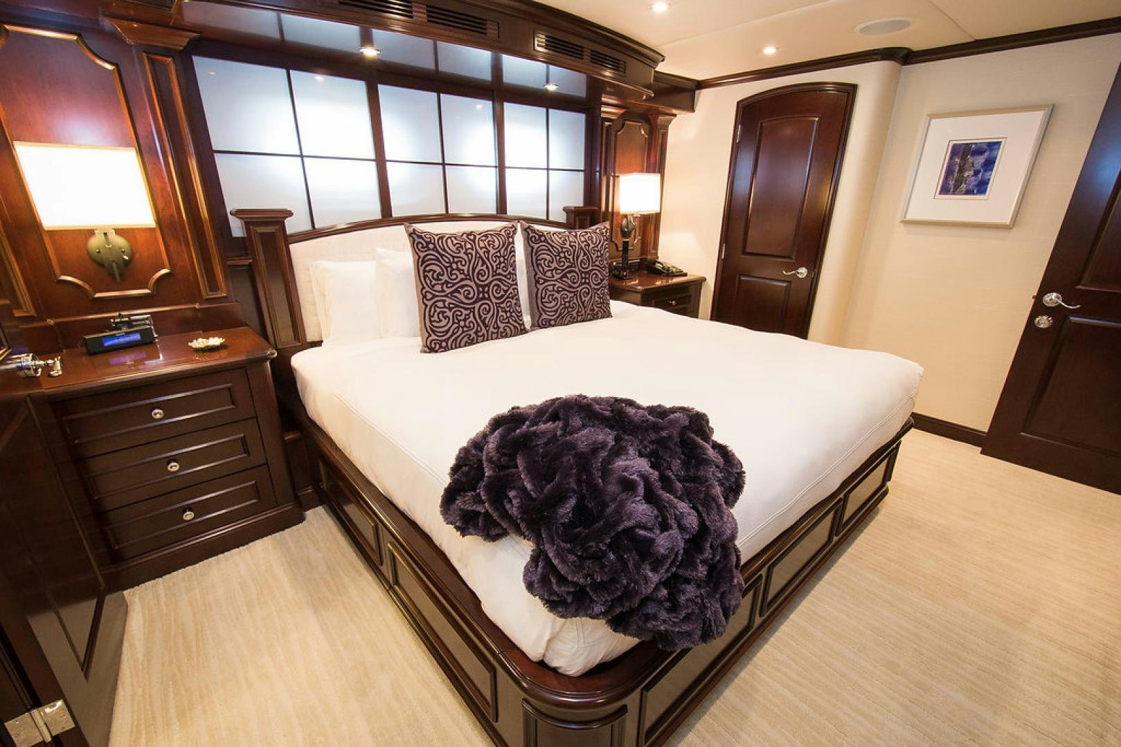 a large bed in a room aboard REBEL Yacht for Sale