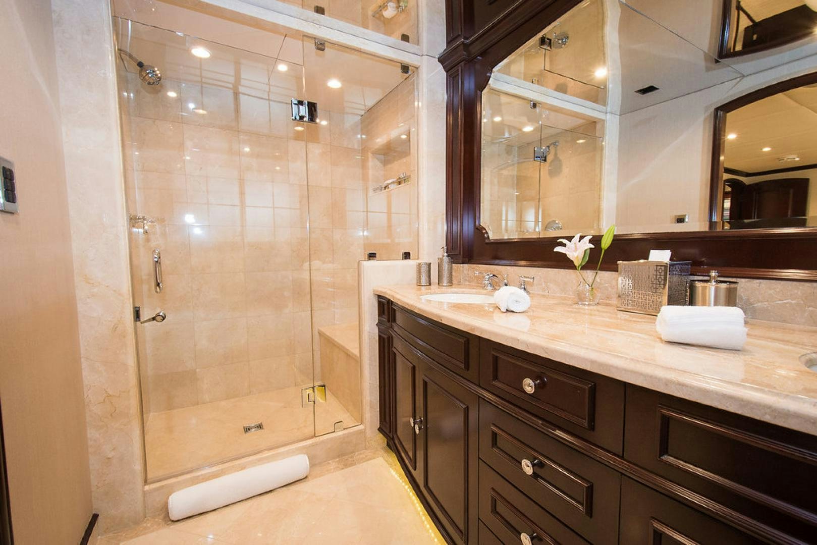 a bathroom with a large mirror aboard REBEL Yacht for Sale