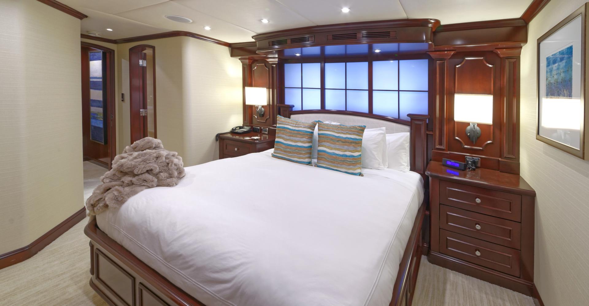 a bedroom with a large bed aboard REBEL Yacht for Sale