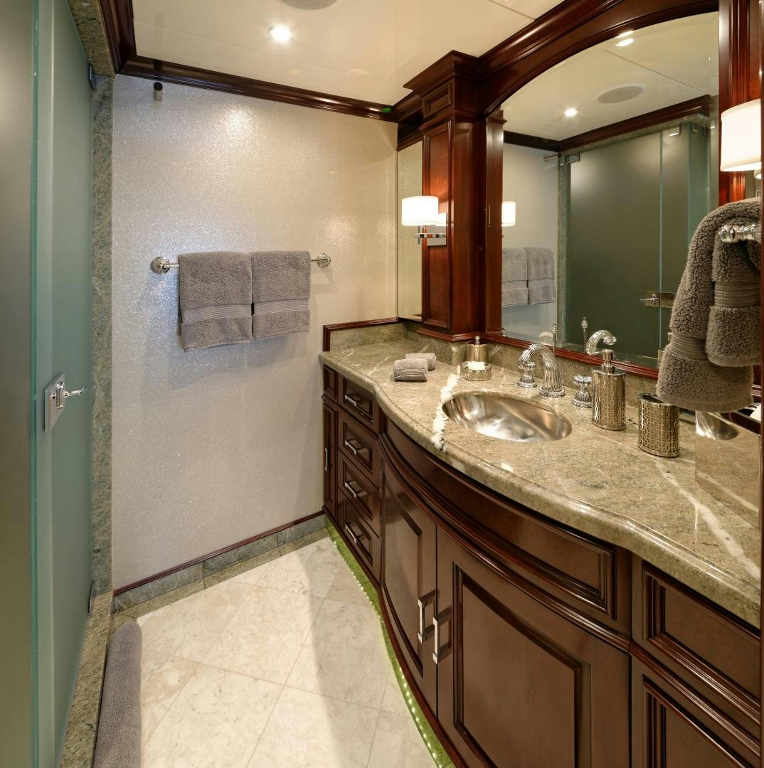 a bathroom with a sink and a mirror aboard REBEL Yacht for Sale