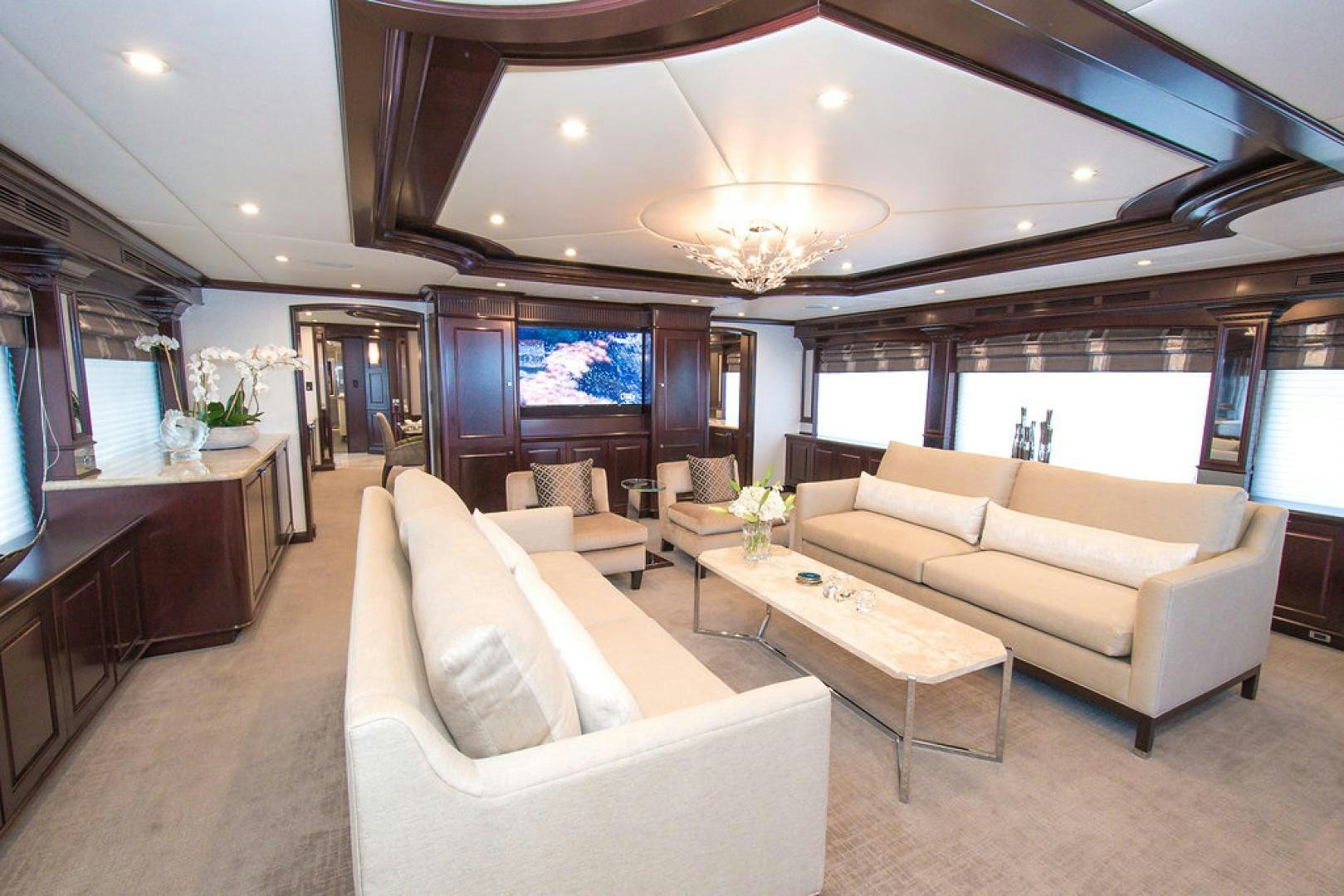 a living room with a large window aboard REBEL Yacht for Sale