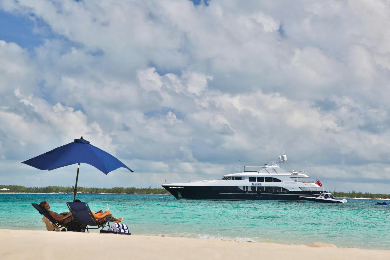 a boat on the beach aboard REBEL Yacht for Sale