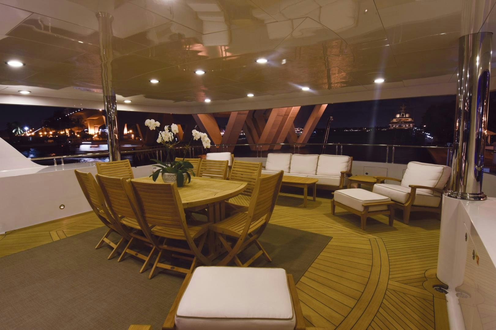 a room with tables and chairs aboard REBEL Yacht for Sale