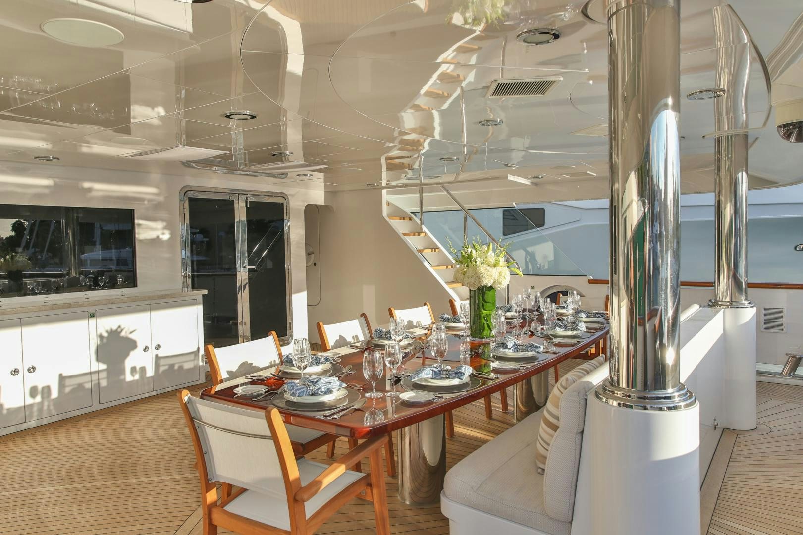a dining room with a table and chairs aboard REBEL Yacht for Sale