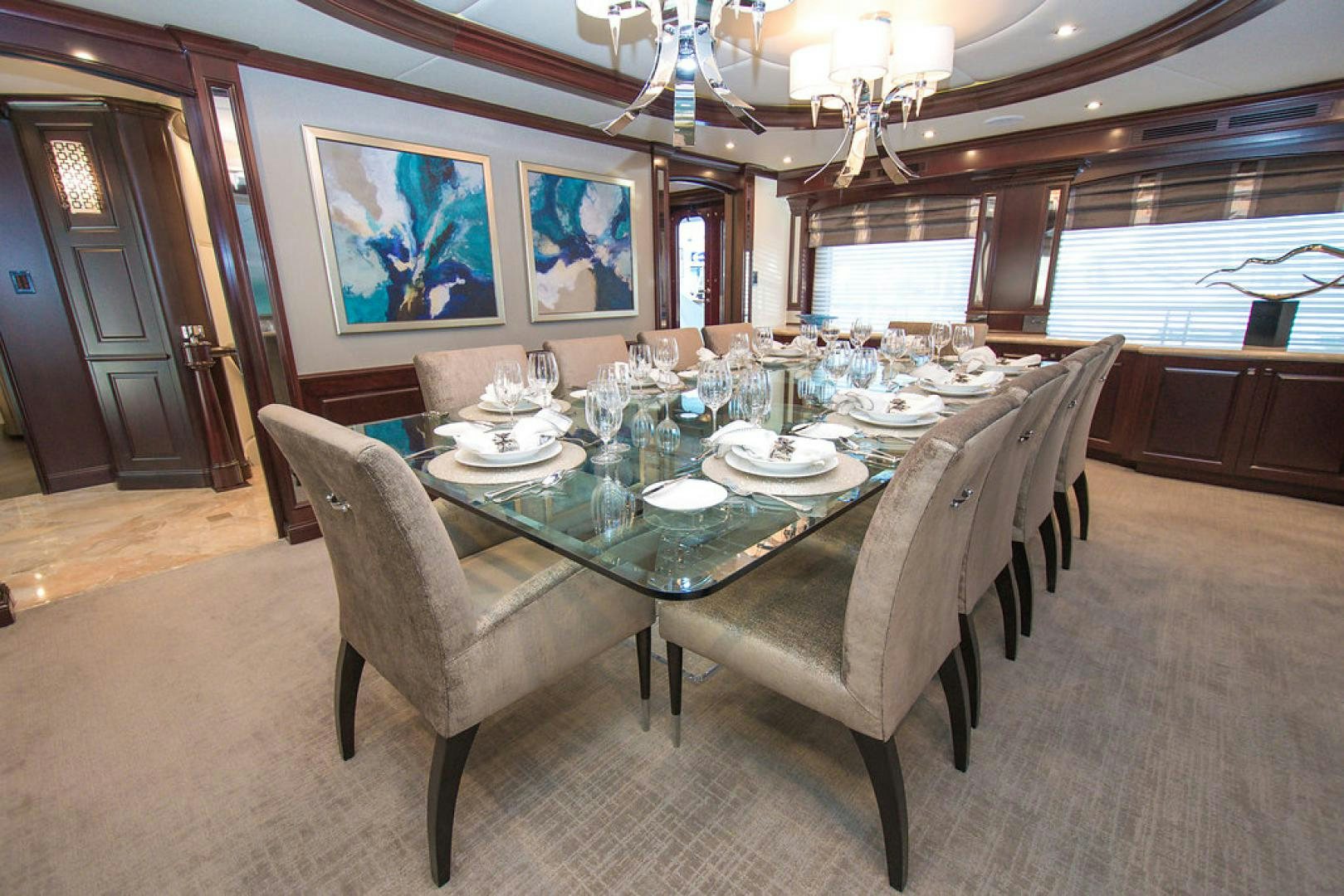 a dining room with a table set aboard REBEL Yacht for Sale