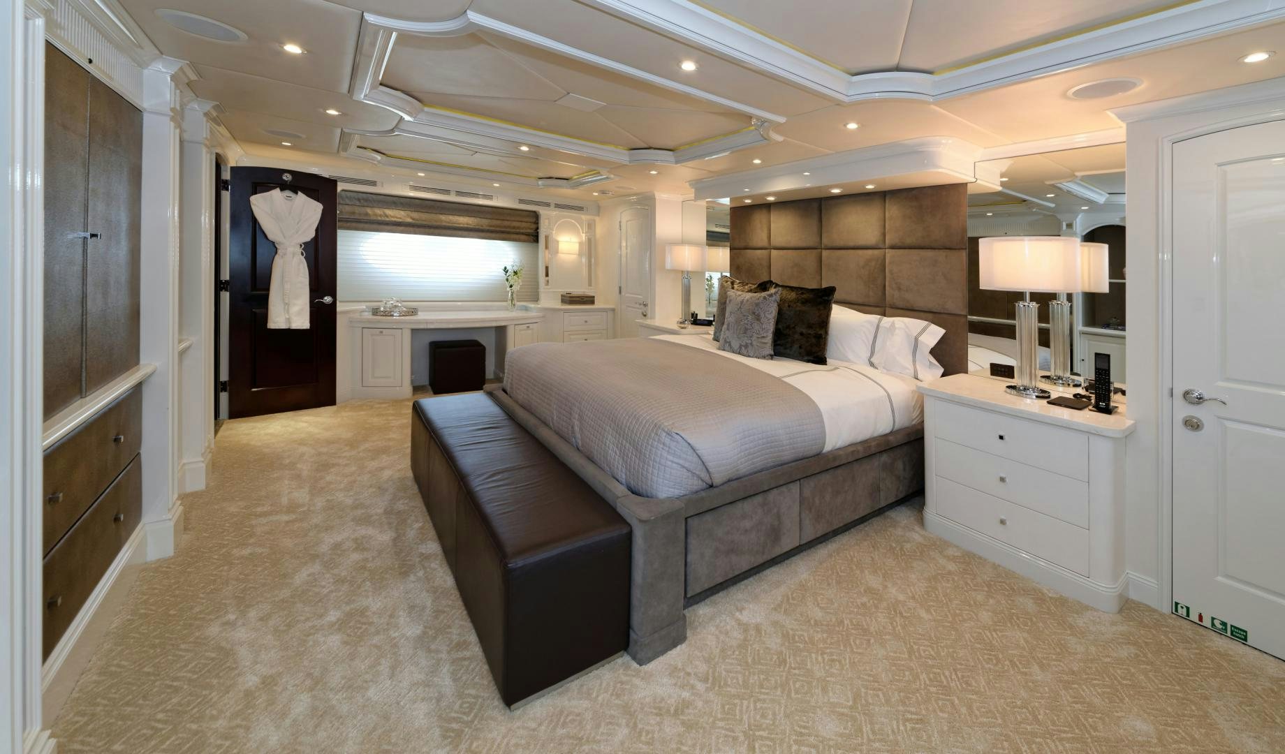 a large bedroom with a large bed aboard REBEL Yacht for Sale