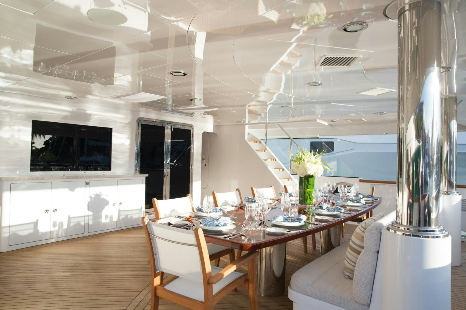 a room with a table and chairs aboard REBEL Yacht for Sale