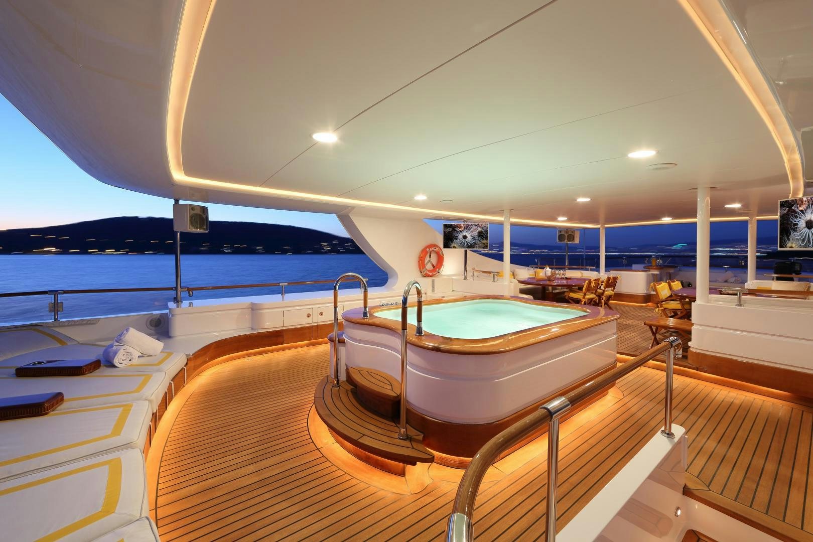 a room with a table and a pool table aboard DR NO NO Yacht for Sale