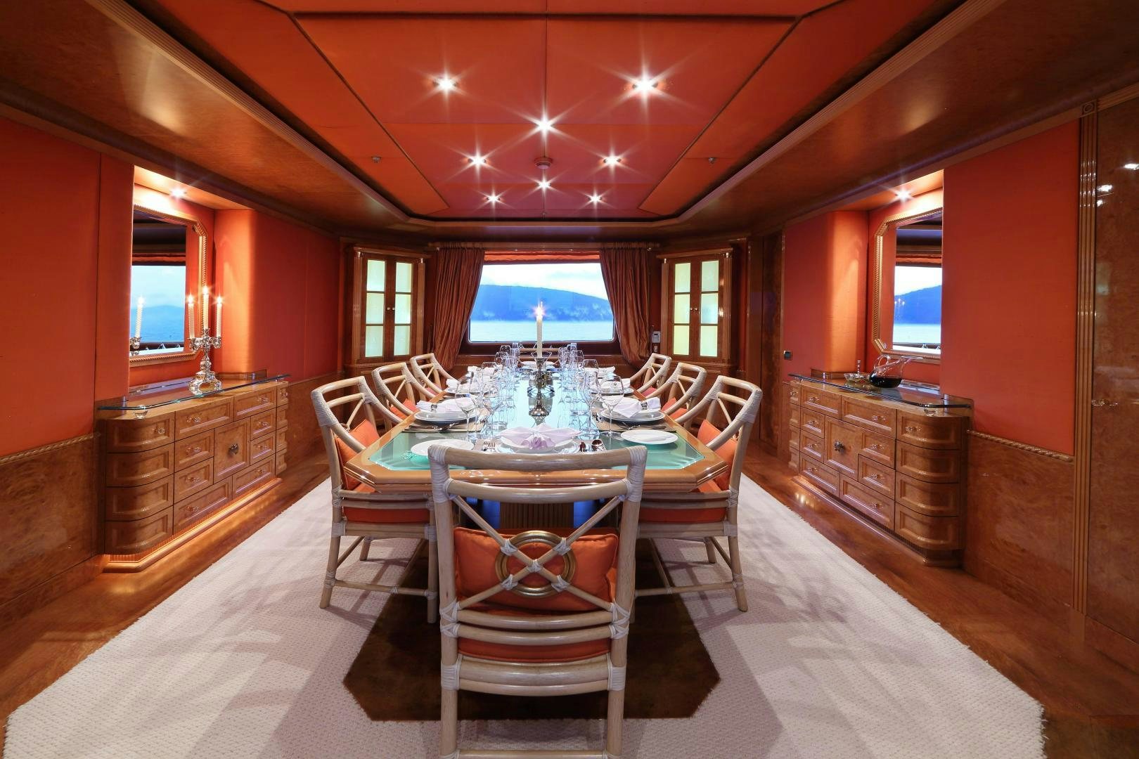 a dining room with a table and chairs aboard DR NO NO Yacht for Sale