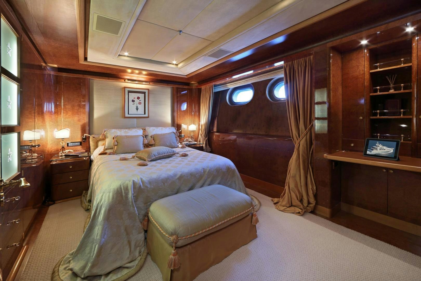 a bedroom with a bed and a desk aboard DR NO NO Yacht for Sale