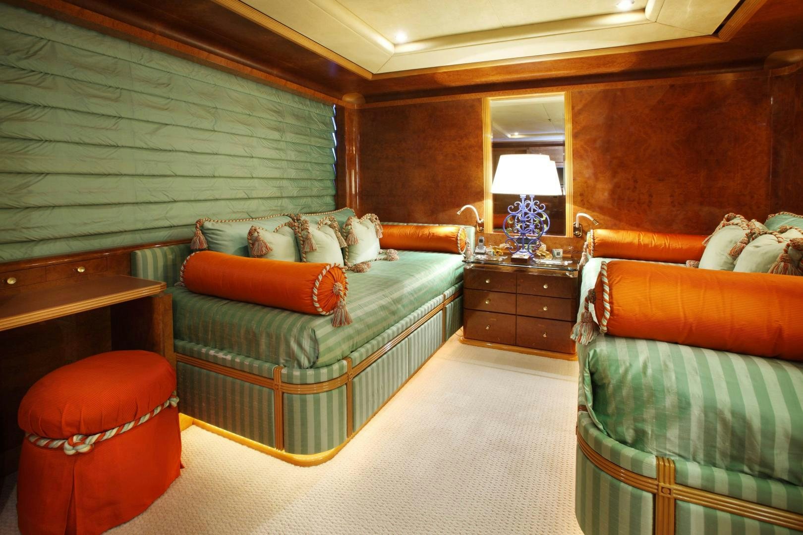 a bedroom with a bed and a couch aboard DR NO NO Yacht for Sale