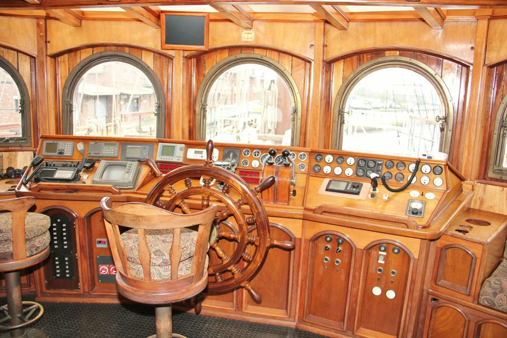 a large wooden piano aboard PEACEMAKER Yacht for Sale