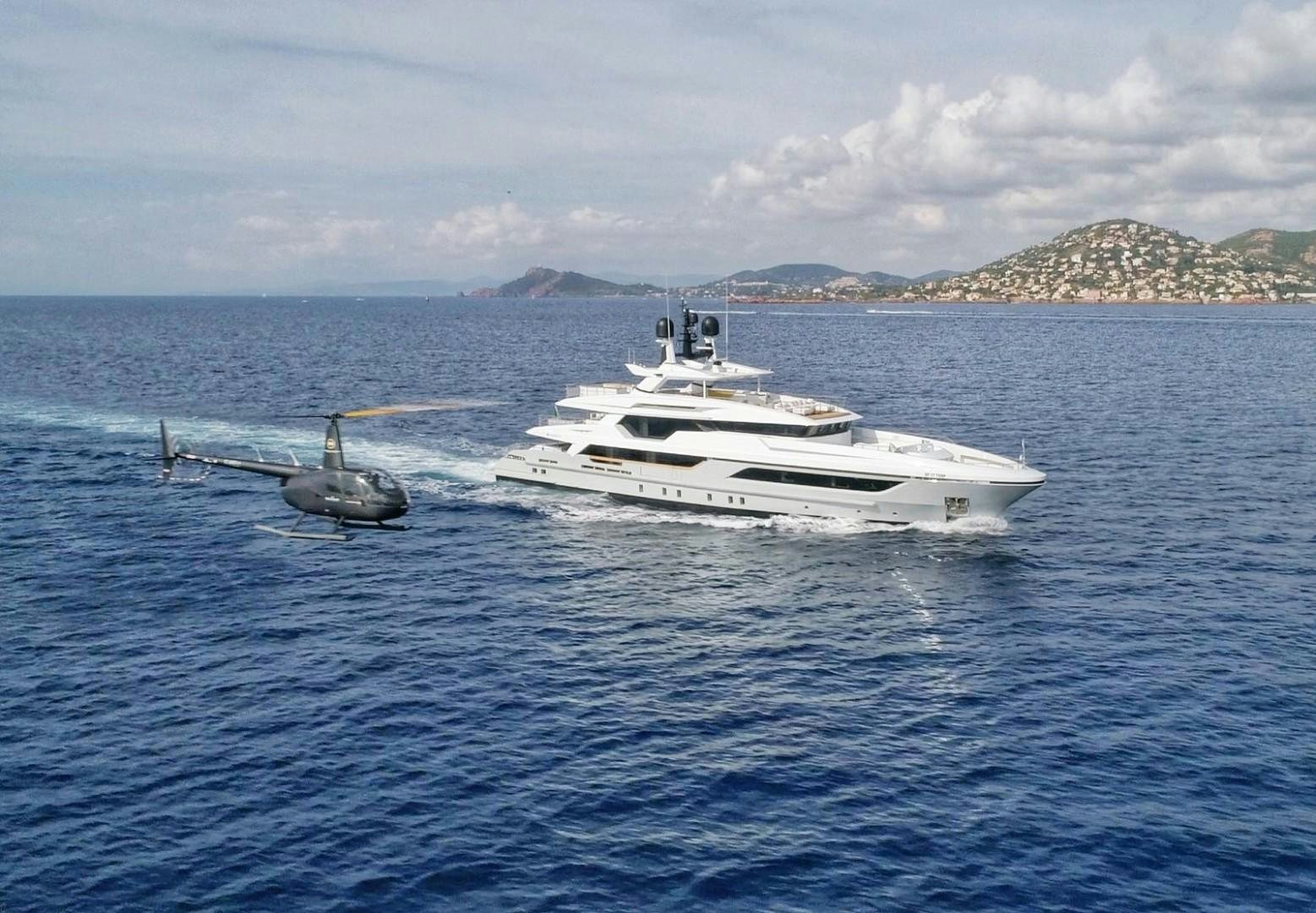 a boat and a helicopter in the water aboard BAGLIETTO 48M Yacht for Sale