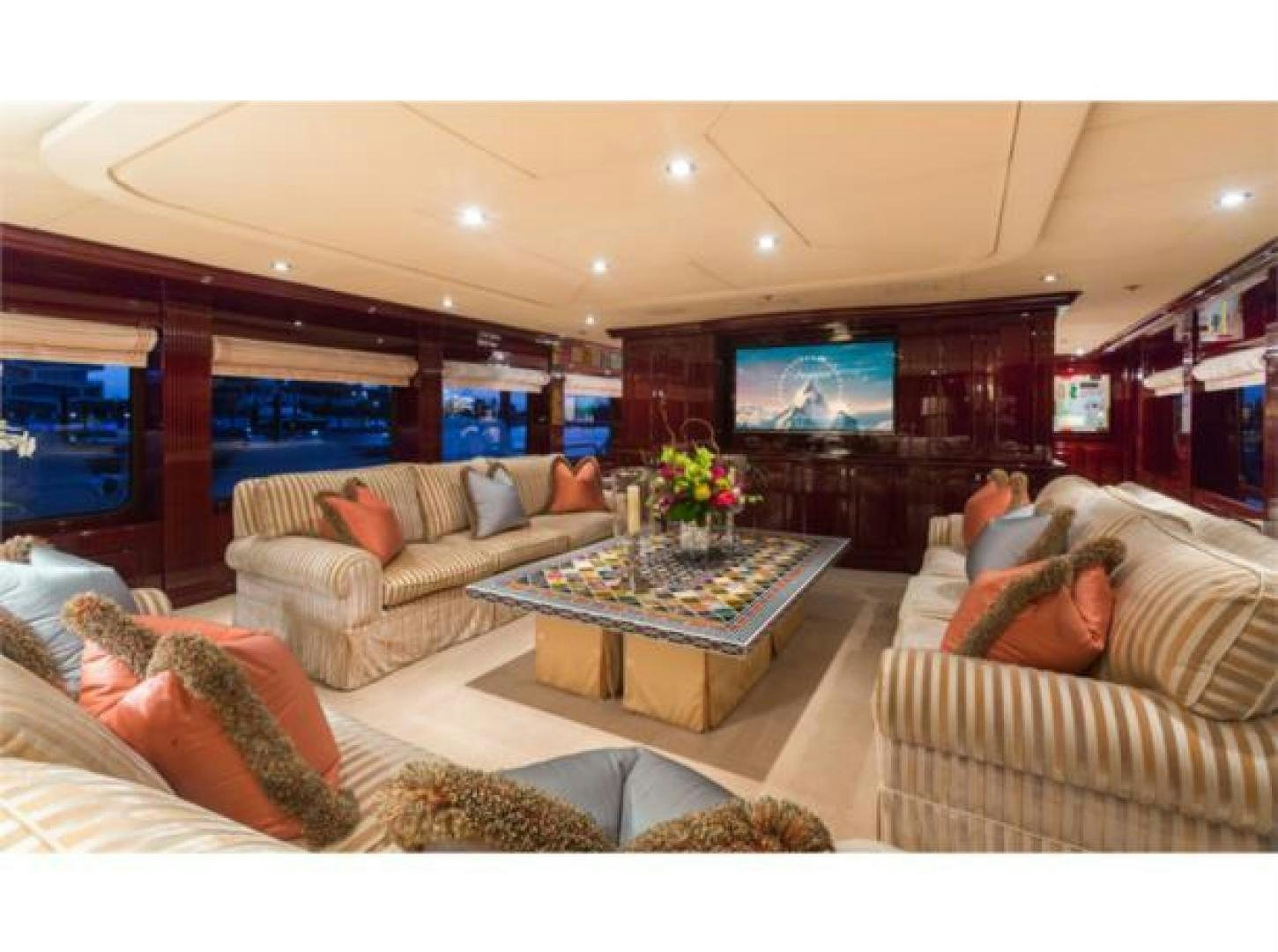 a person sleeping on a couch in a living room aboard LADY JOY Yacht for Sale