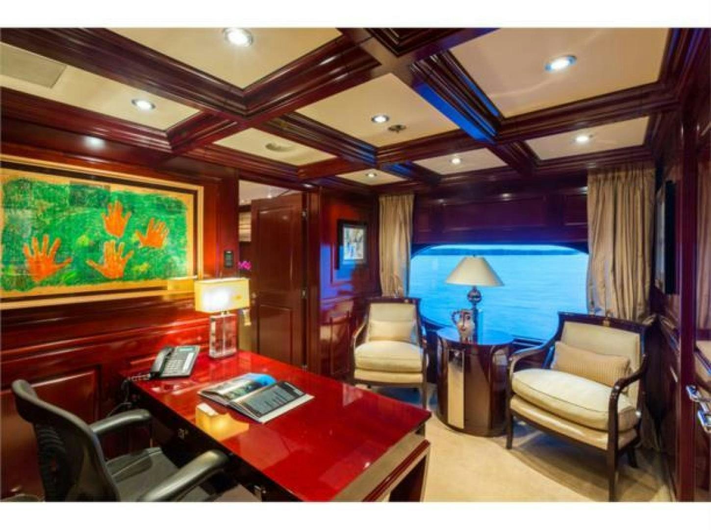 a living room with a table and chairs aboard LADY JOY Yacht for Sale