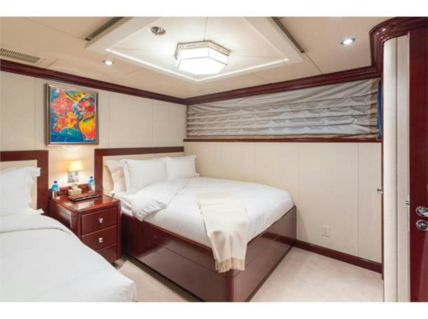 a room with two beds aboard LADY JOY Yacht for Sale