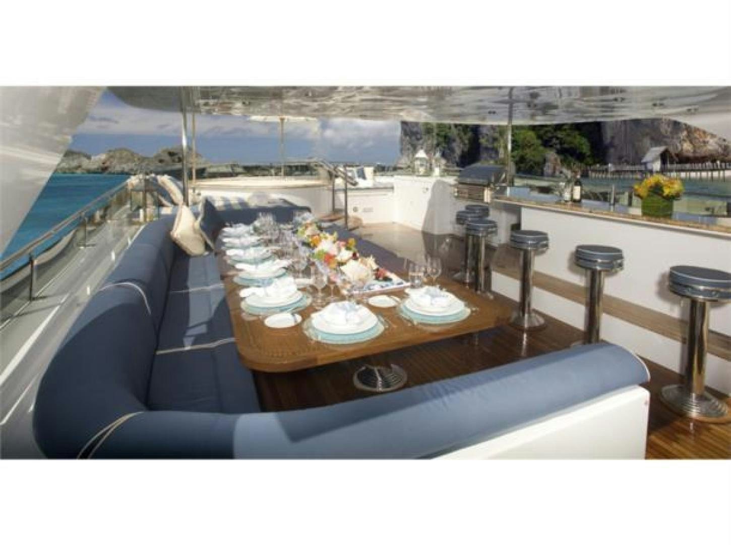 a room with a table and chairs aboard LADY JOY Yacht for Sale