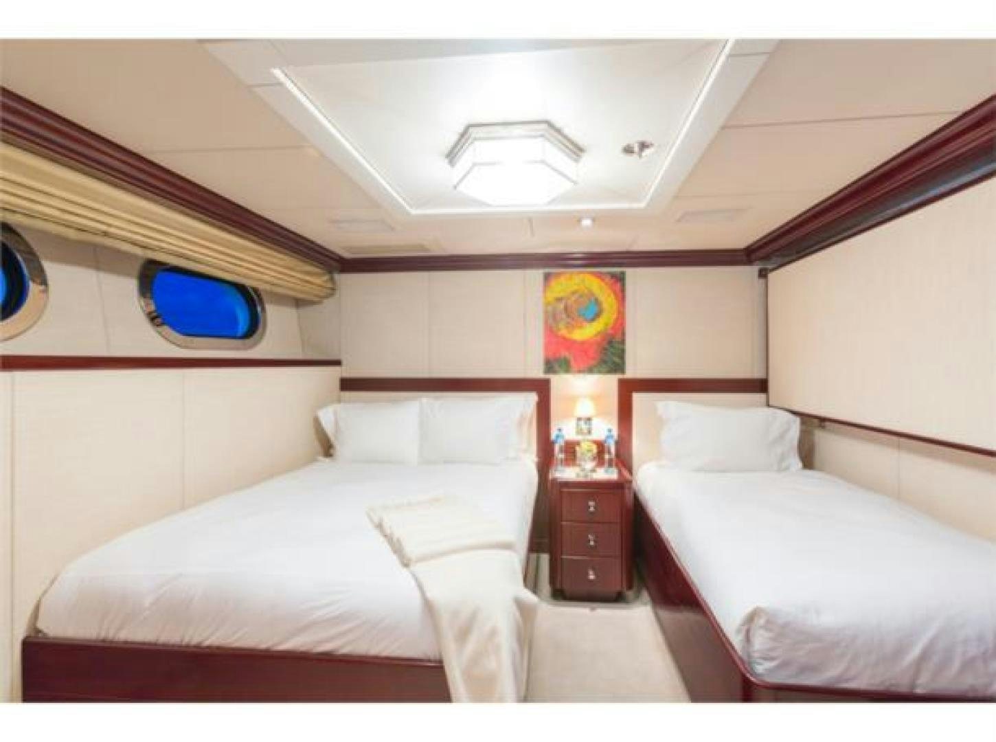 a room with two beds aboard LADY JOY Yacht for Sale