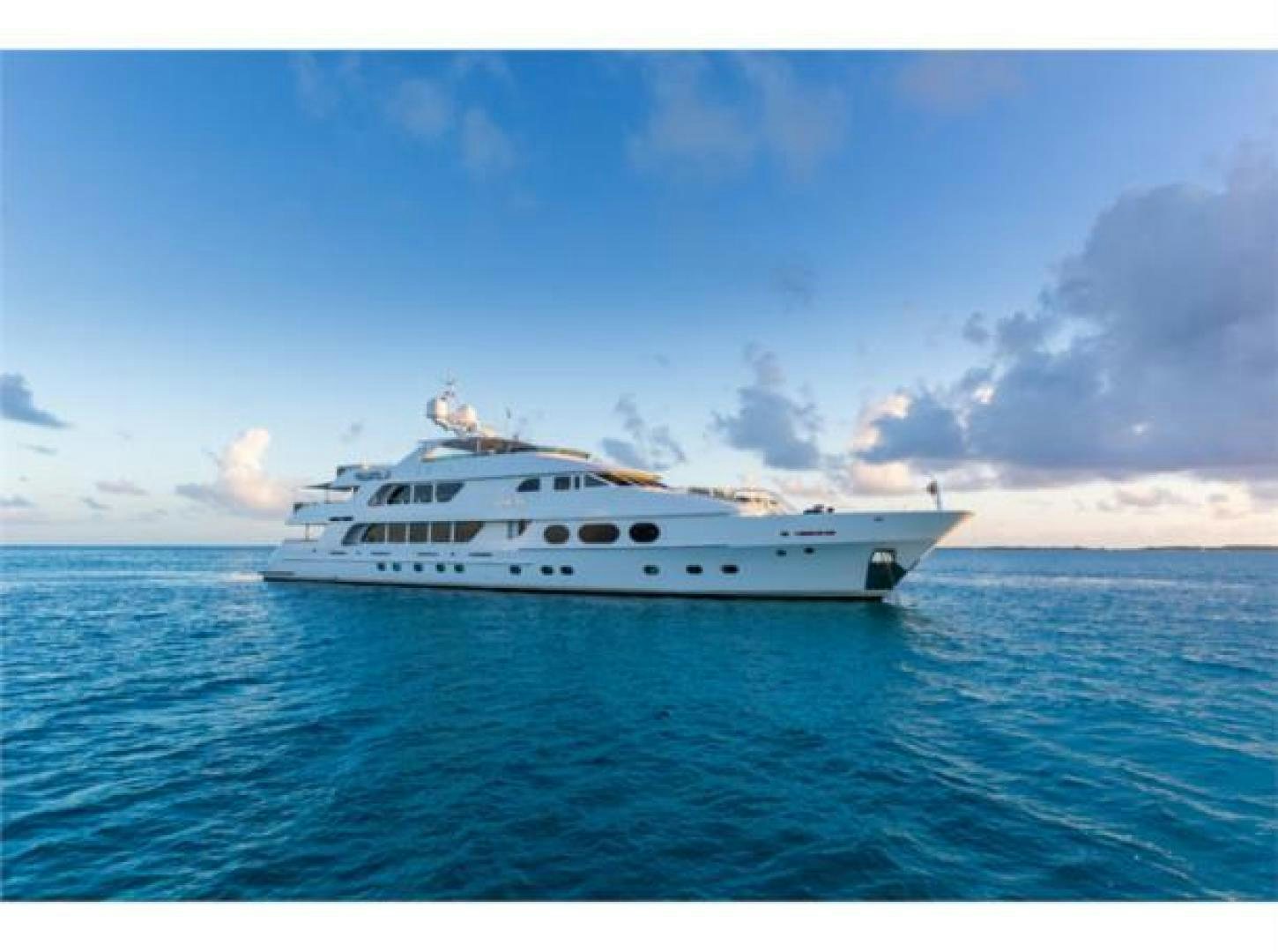 a white yacht on the water aboard LADY JOY Yacht for Sale