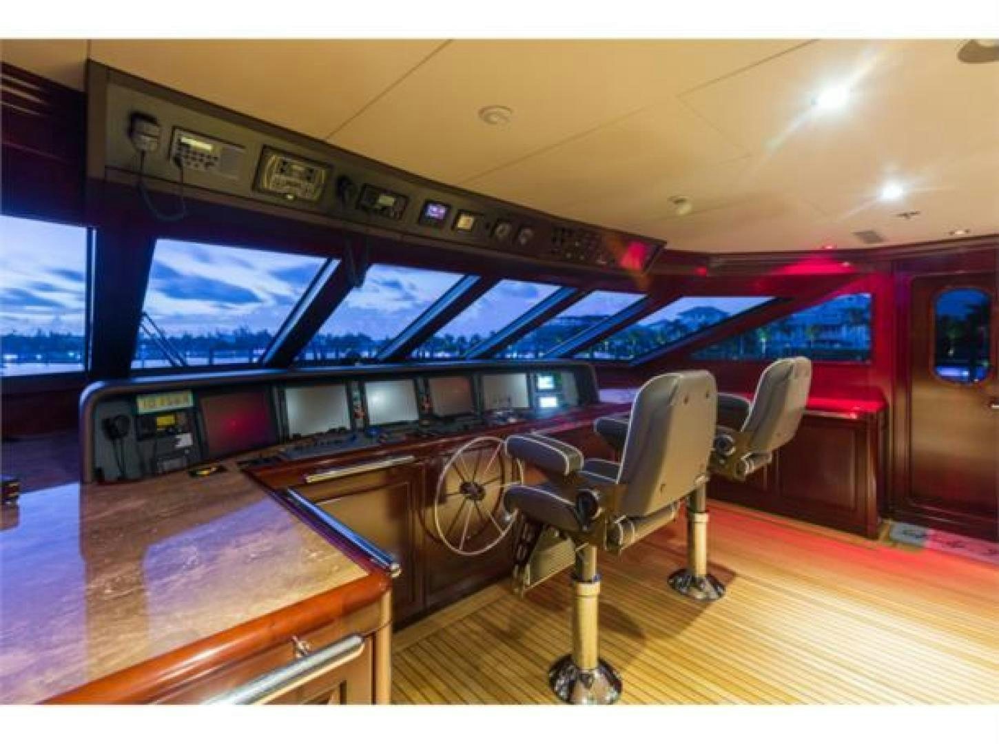 a room with a table and chairs aboard LADY JOY Yacht for Sale