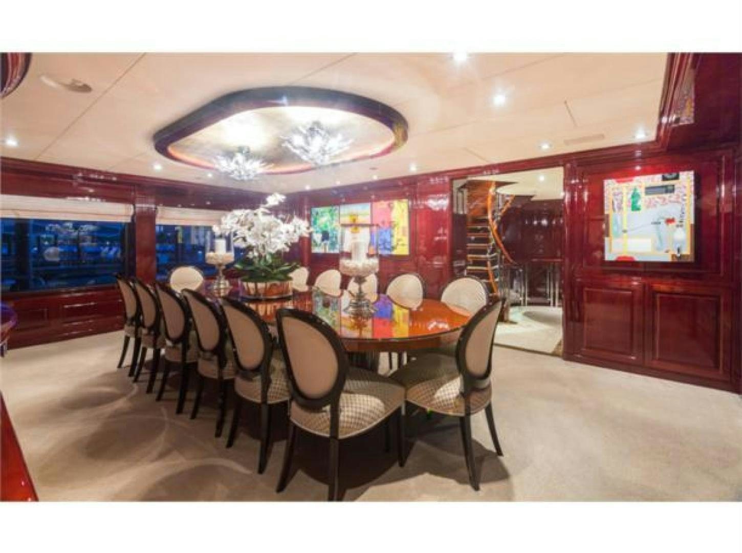 a dining room with a table and chairs aboard LADY JOY Yacht for Sale