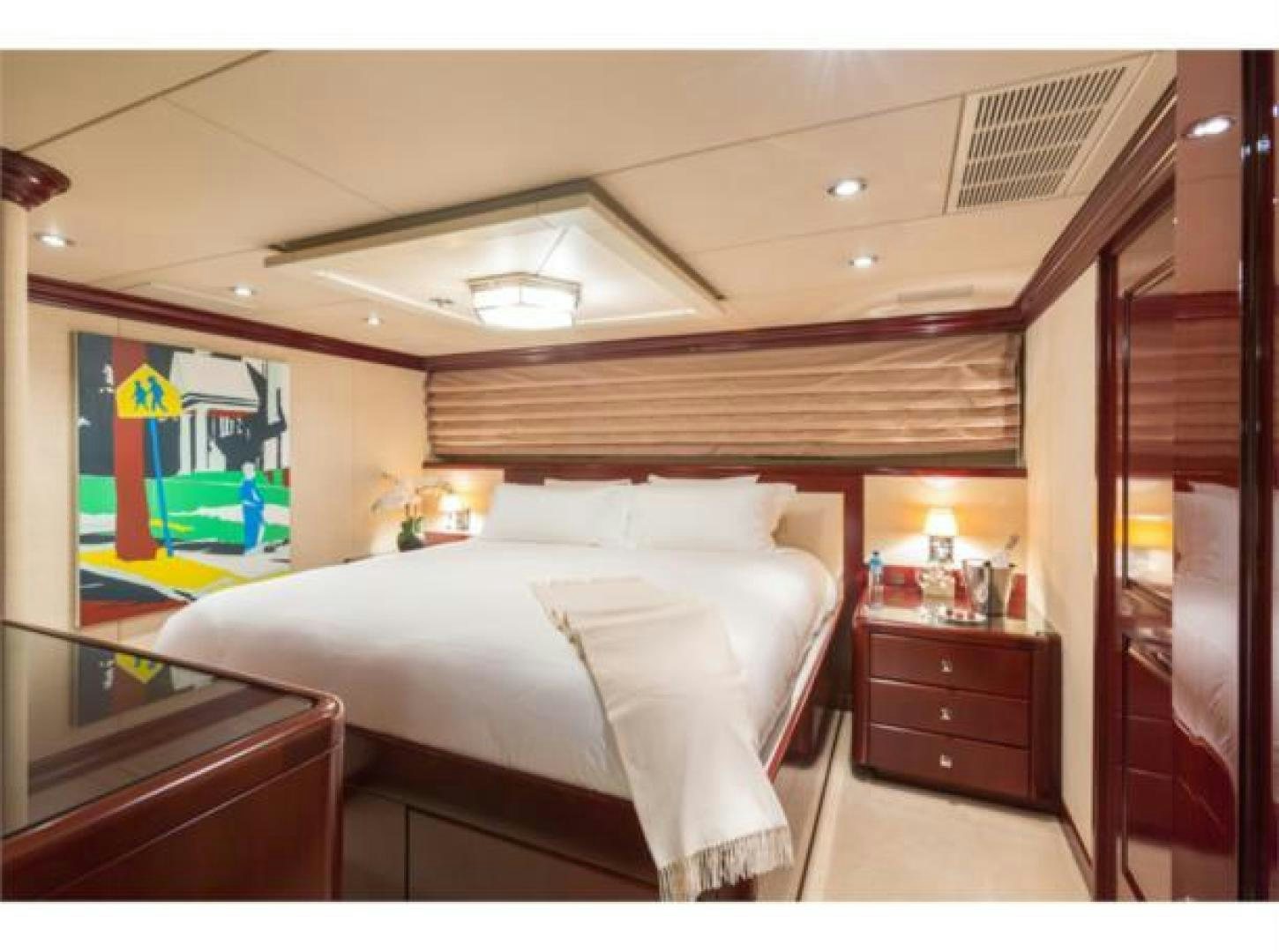 a bedroom with a large bed aboard LADY JOY Yacht for Sale