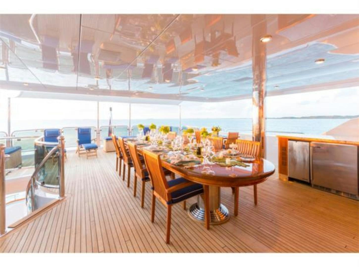 a room with a table and chairs aboard LADY JOY Yacht for Sale