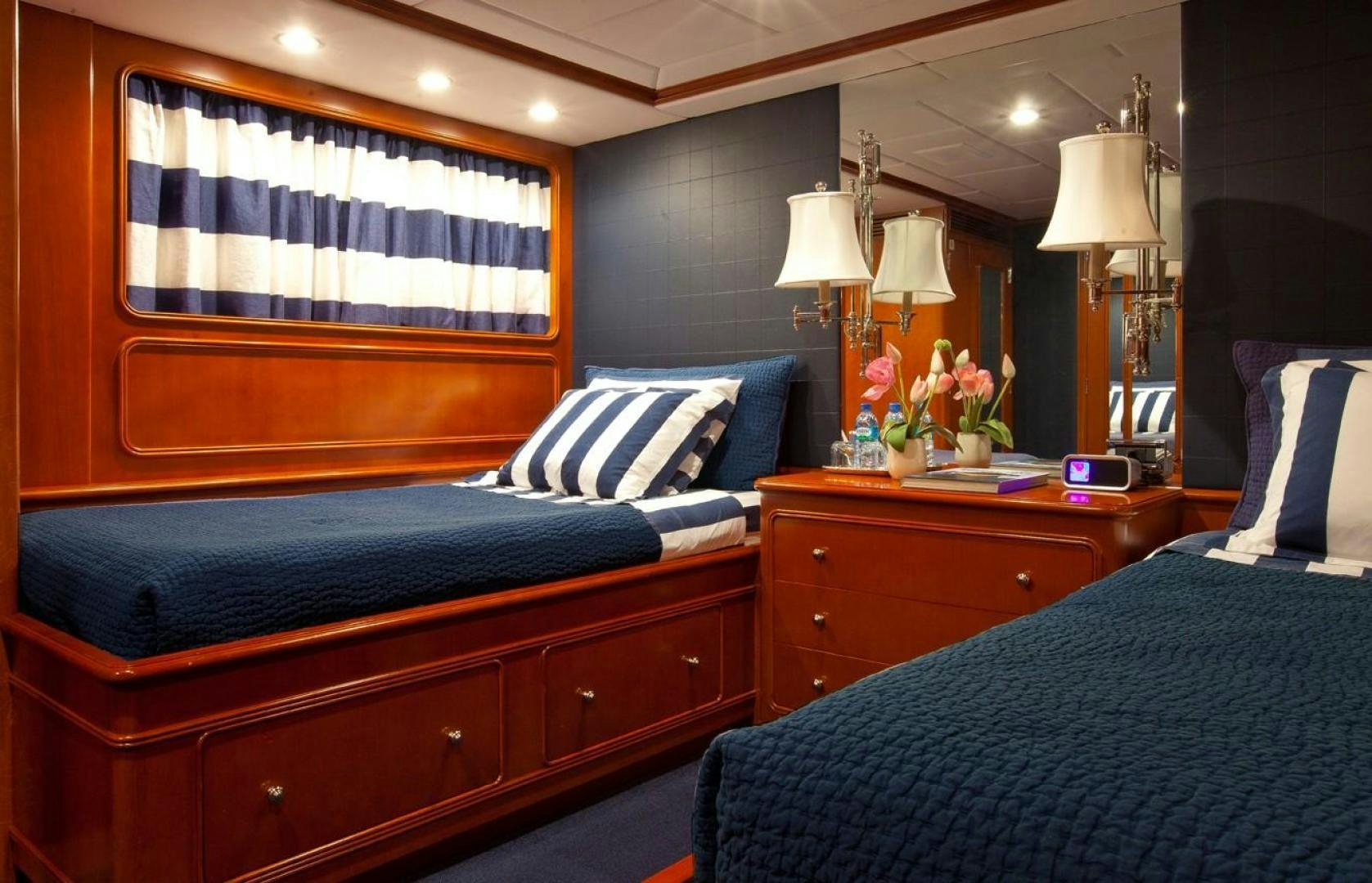a room with a bed and a desk aboard AUDACIA Yacht for Sale