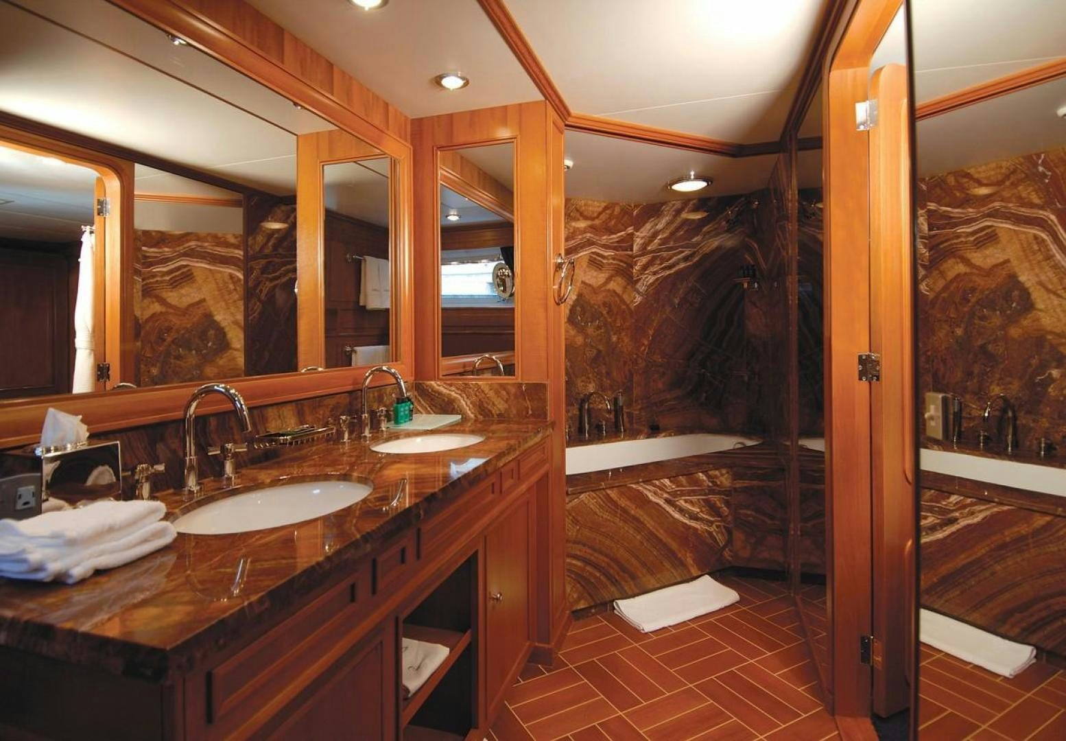 a bathroom with a large mirror aboard AUDACIA Yacht for Sale