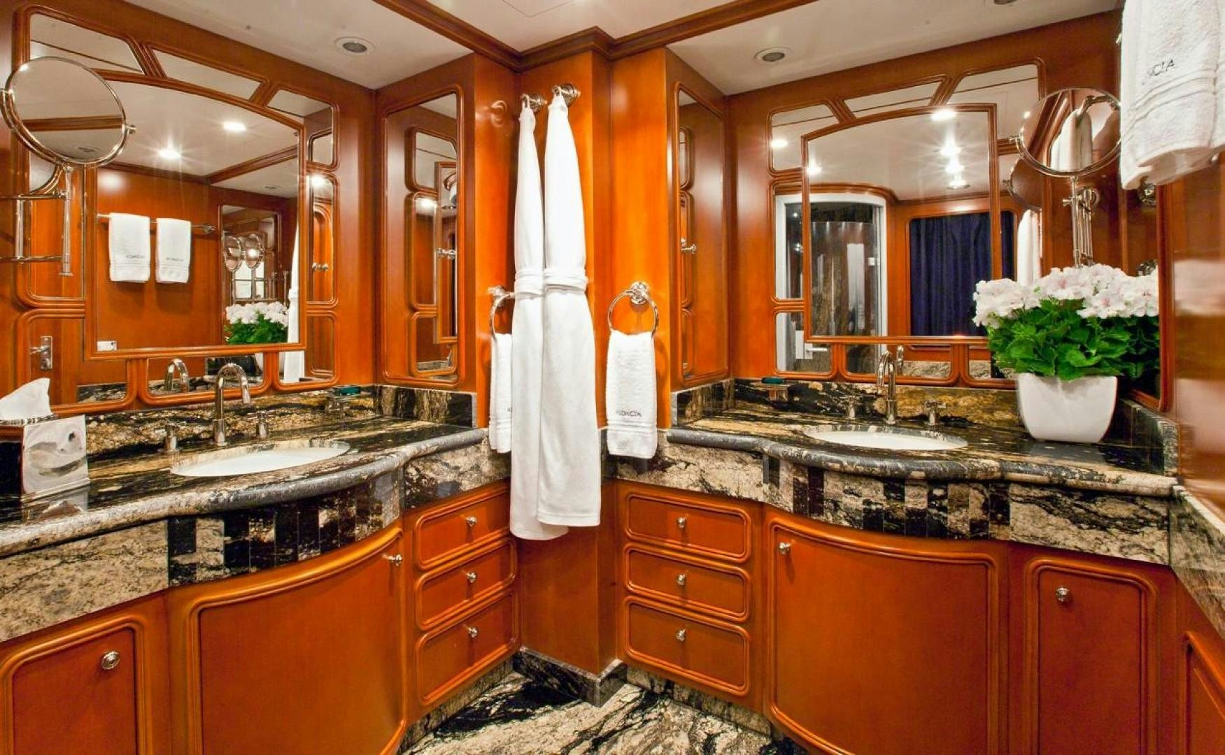 a bathroom with orange and white cabinets aboard AUDACIA Yacht for Sale