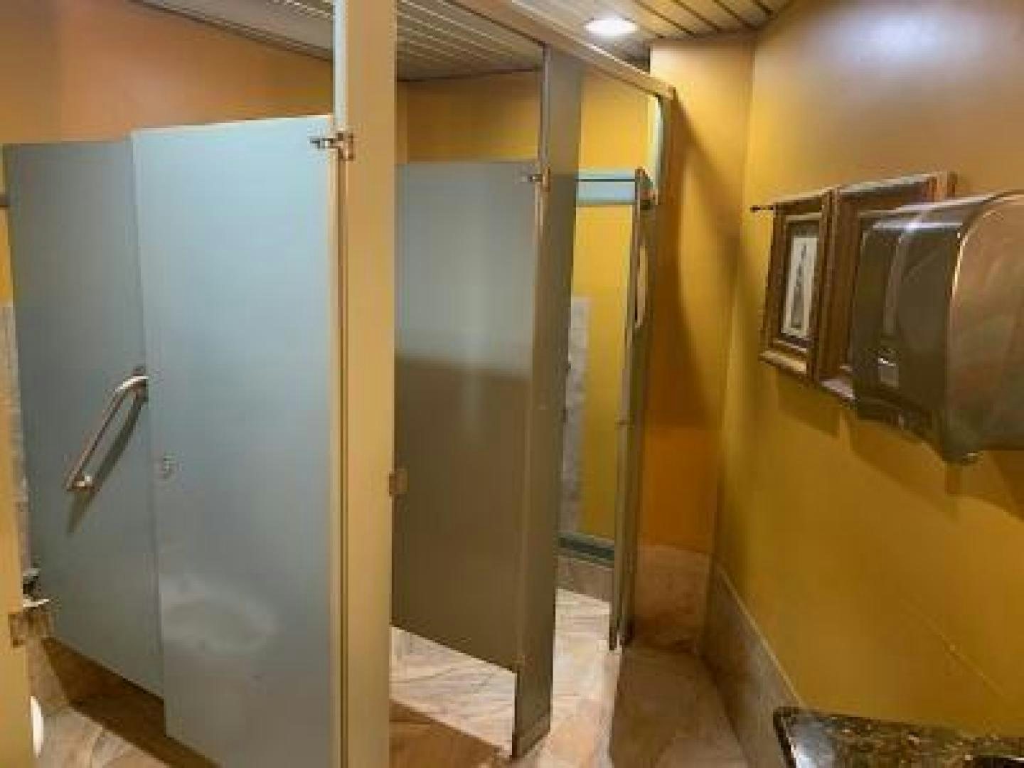 a bathroom with a couple of stalls aboard No Name Yacht for Sale