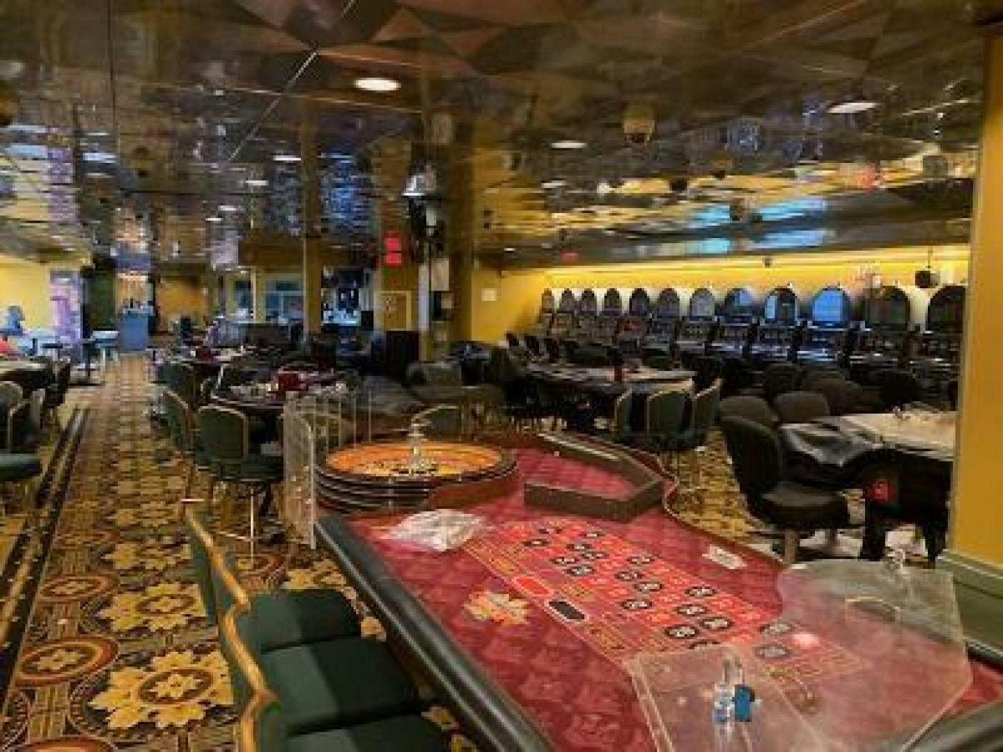 inside of a building with tables and chairs aboard No Name Yacht for Sale