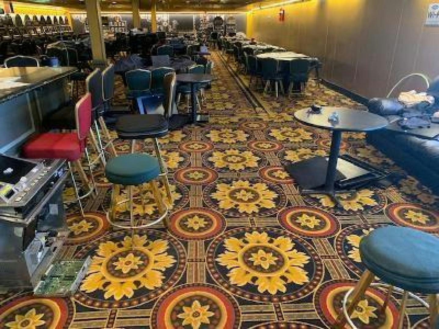 a room with tables and chairs aboard No Name Yacht for Sale