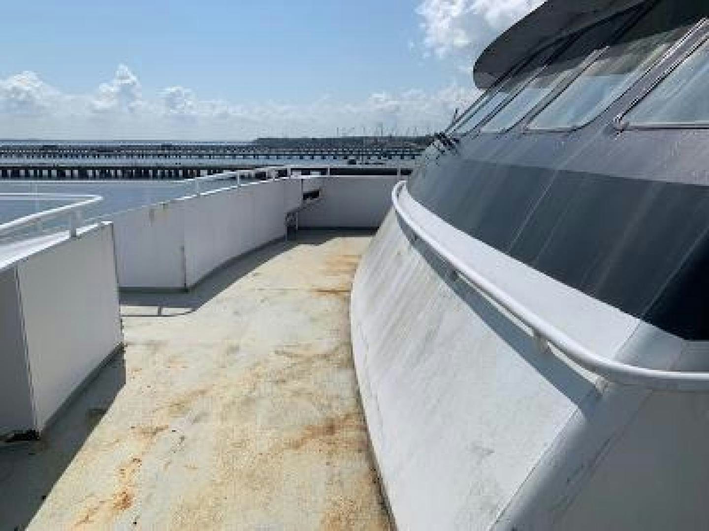 a large building with a balcony aboard No Name Yacht for Sale
