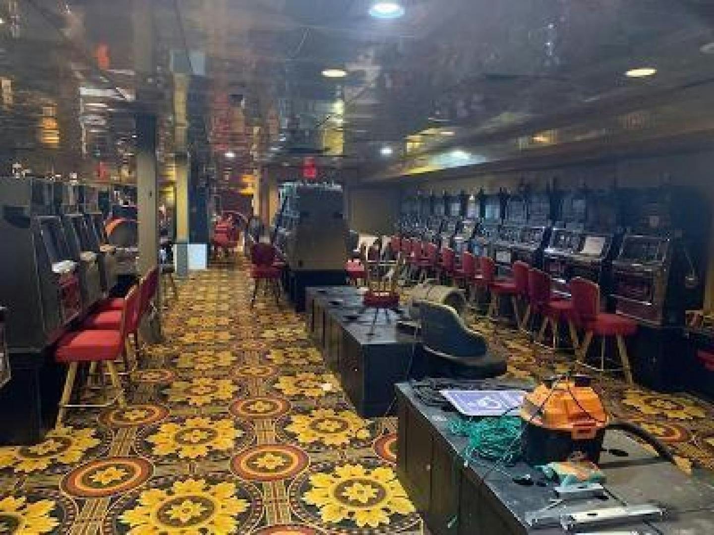 a room with chairs and tables aboard No Name Yacht for Sale