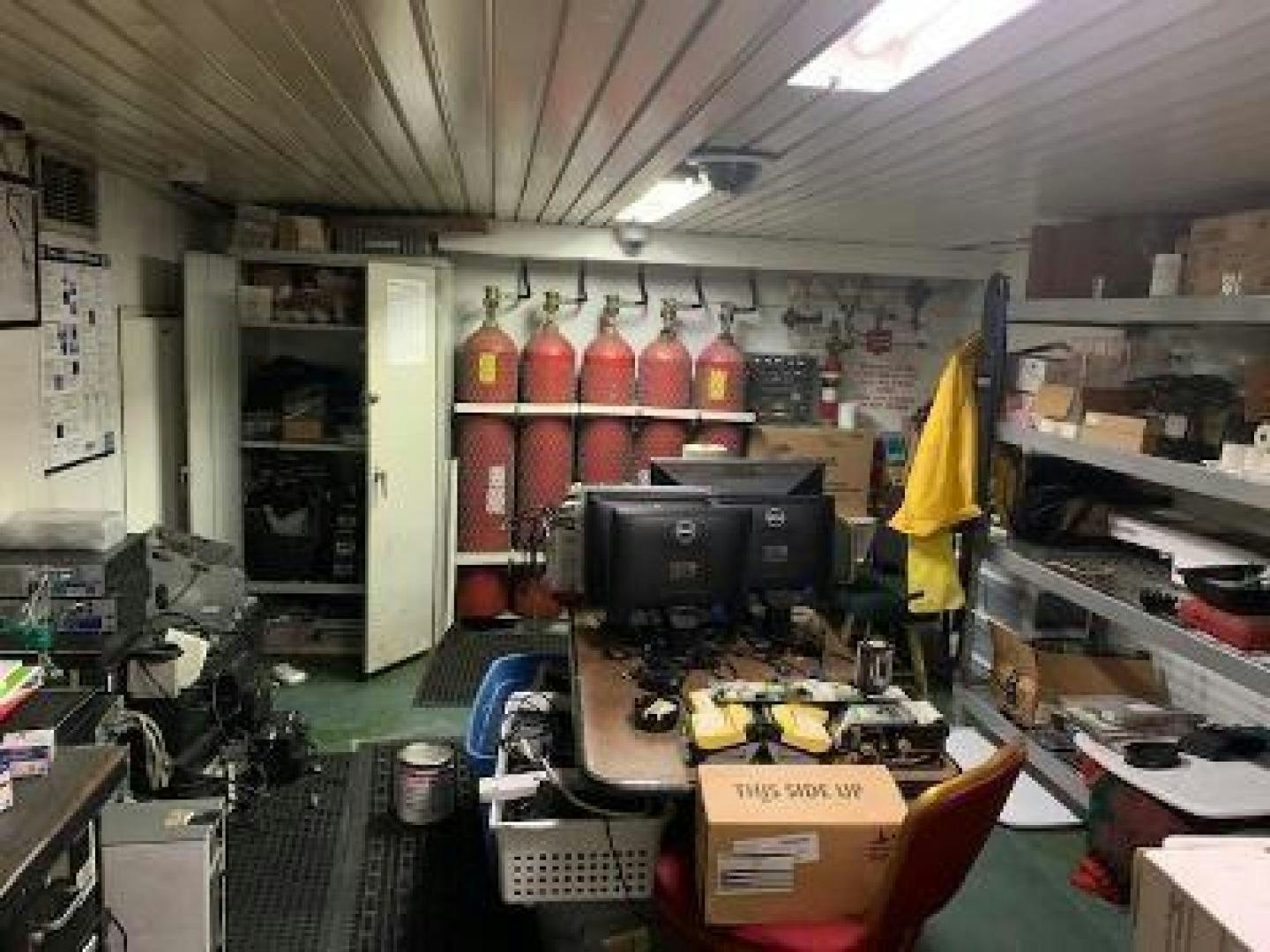a store with shelves of bottles aboard No Name Yacht for Sale