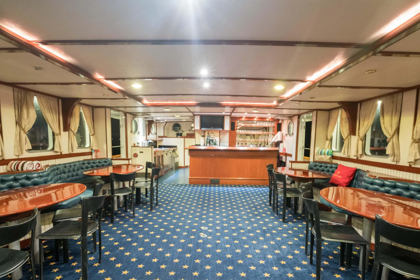 a large room with tables and chairs aboard ARABELLA Yacht for Sale