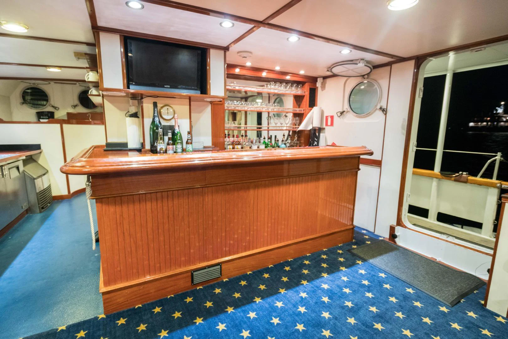 a kitchen with a counter and a television aboard ARABELLA Yacht for Sale