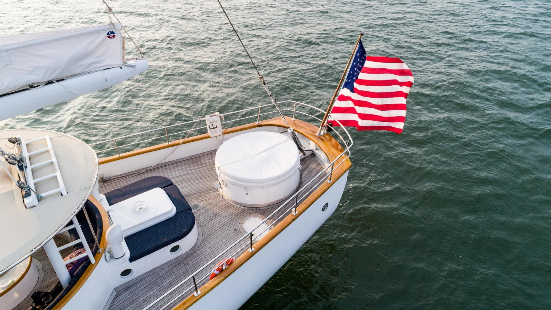 a boat with a flag on the front aboard ARABELLA Yacht for Sale