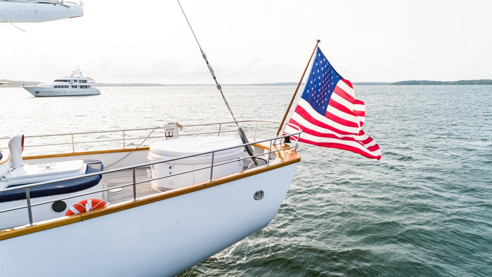 a boat with a flag on it aboard ARABELLA Yacht for Sale