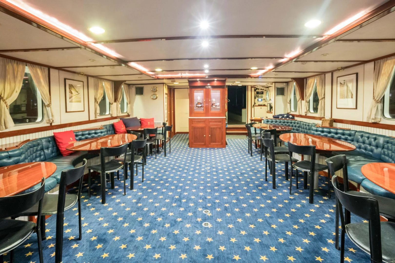 a room with tables and chairs aboard ARABELLA Yacht for Sale