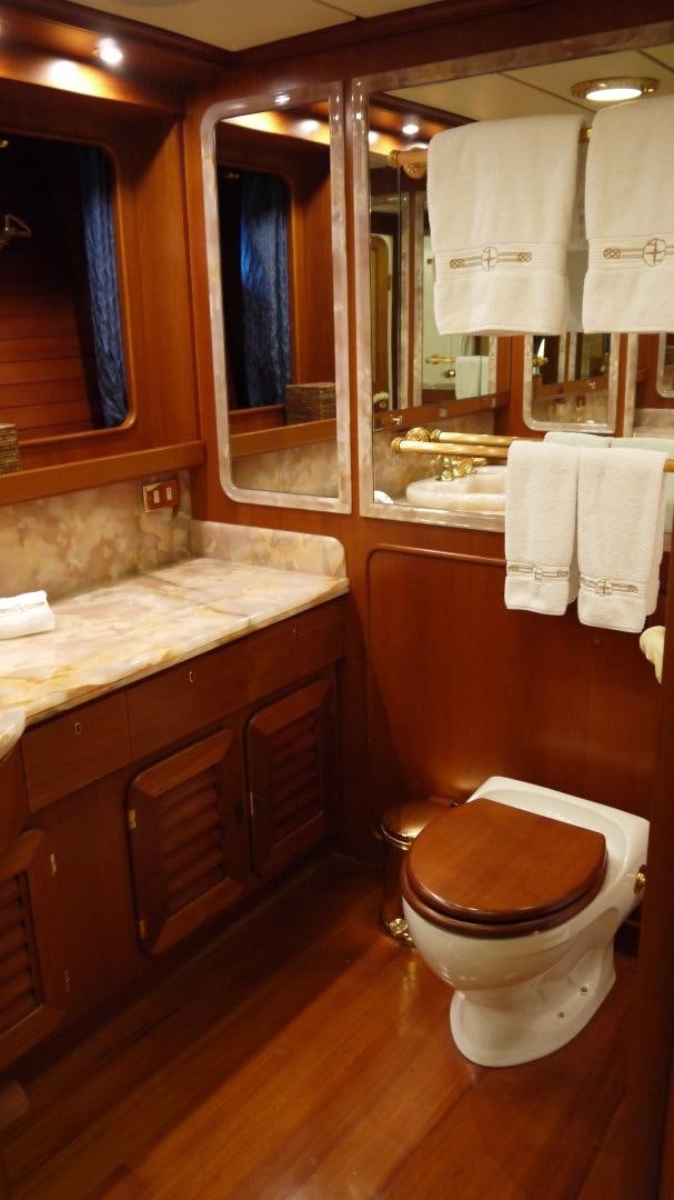 a bathroom with a toilet and a mirror aboard ANDROMEDA LA DEA Yacht for Sale