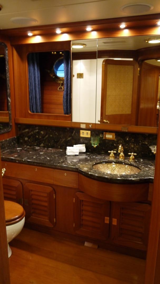 a bathroom with a large mirror aboard ANDROMEDA LA DEA Yacht for Sale