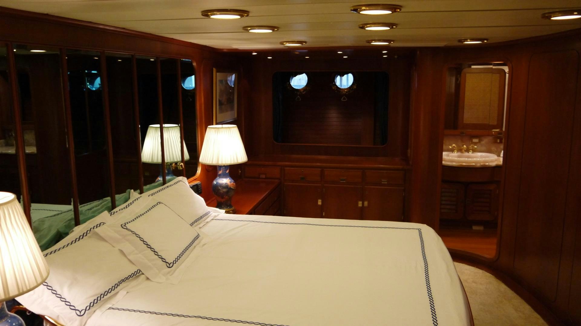 a bed in a hotel room aboard ANDROMEDA LA DEA Yacht for Sale