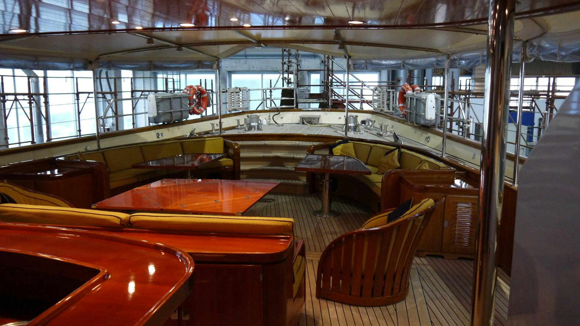 a room with tables and chairs aboard ANDROMEDA LA DEA Yacht for Sale