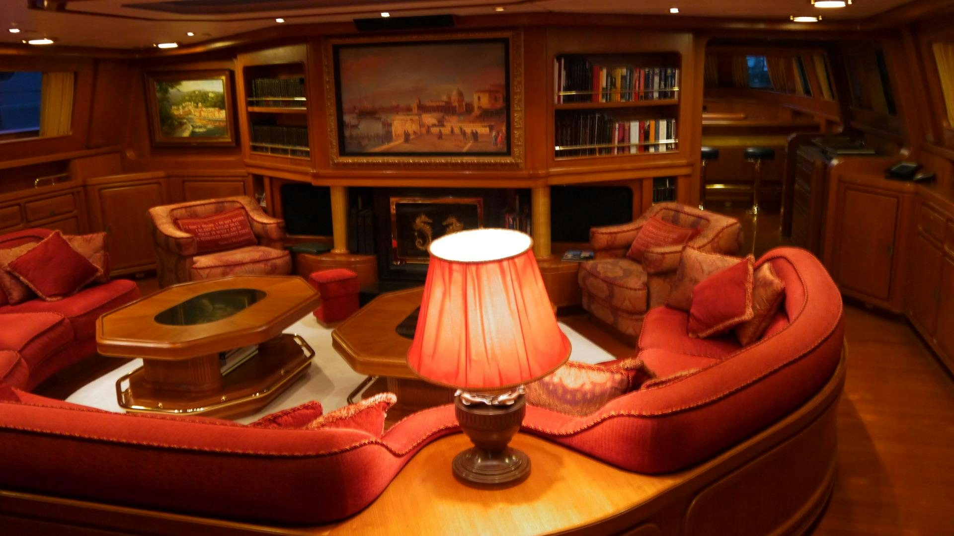 a living room with a lamp and a table aboard ANDROMEDA LA DEA Yacht for Sale