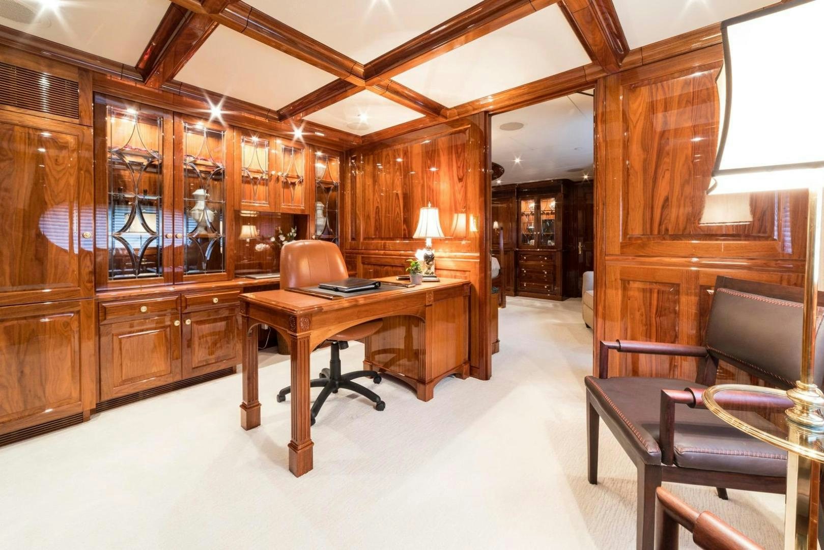 a room with a desk and chairs aboard POPEYE Yacht for Sale