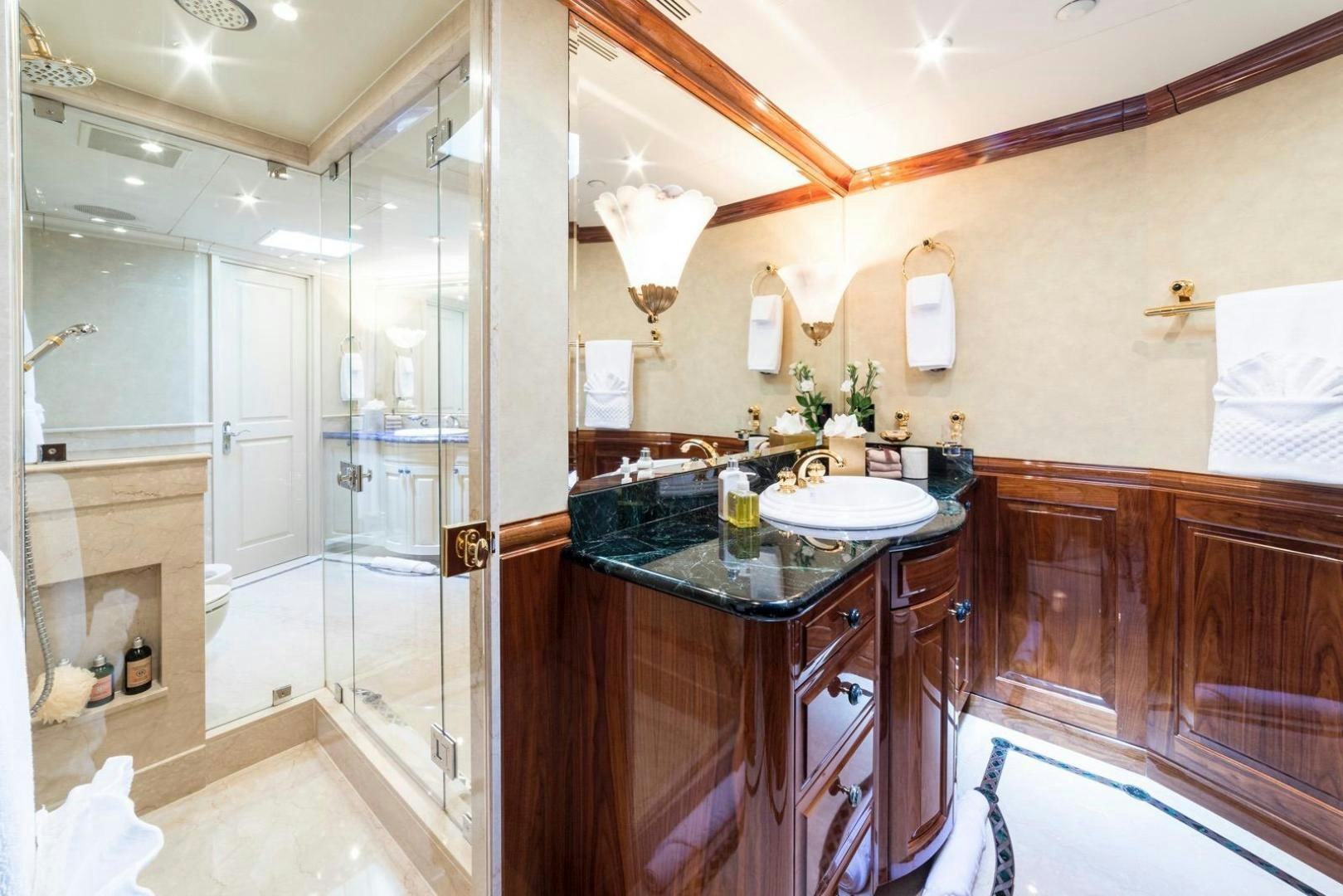 a bathroom with a glass shower aboard POPEYE Yacht for Sale