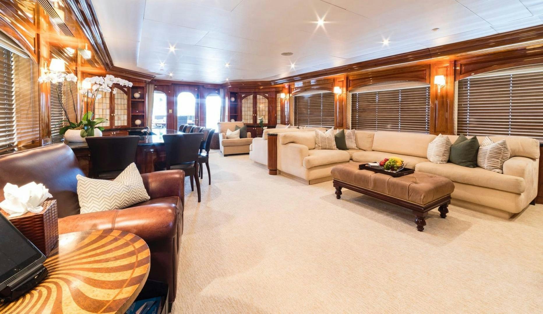 a living room with a couch and a table aboard POPEYE Yacht for Sale